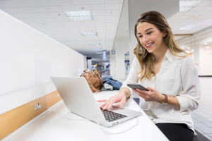 Woman using Phone Charging Station